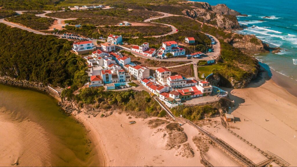 an aerial shot of residential buildings and hotels near the Algarve seacoast in Portugal